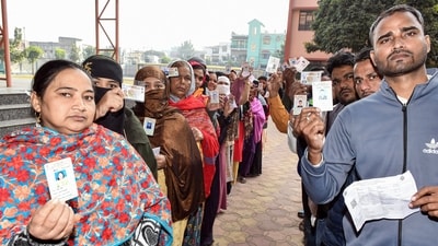 Voters show their IDs while waiting in queues to cast their vote for the second and final phase of the Jharkhand assembly election. (ANI) Voters show their IDs while waiting in queues to cast their vote for the second and final phase of the Jharkhand assembly election. (ANI)