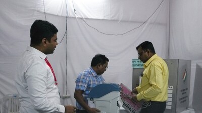 Election officials make preparations at a polling station on the day of the Maharashtra state elections, in Mumbai, India. (REUTERS)