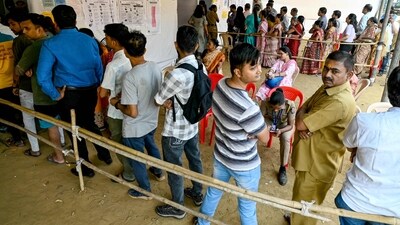 Voters stand in queues to cast their ballots to vote at a polling booth, during the Maharashtra state assembly elections. (AFP) Voters stand in queues to cast their ballots to vote at a polling booth, during the Maharashtra state assembly elections. (AFP)