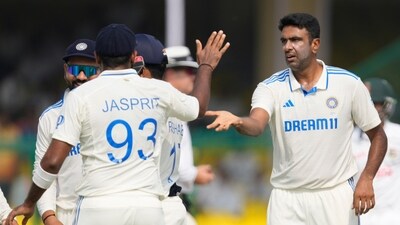 India's Ravichandran Ashwin, right, and Jasprit Bumrah celebrate (AP)