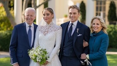 Naomi posing with her grandparents and her husband, Peter Neal, at her wedding in 2022 (White House)