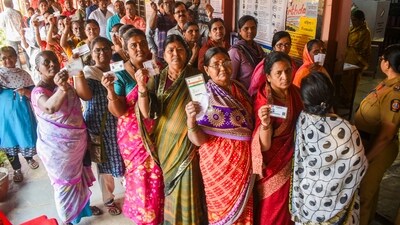 Solapur: People wait in a queue to cast votes at a polling station during the Maharashtra assembly election. (PTI)