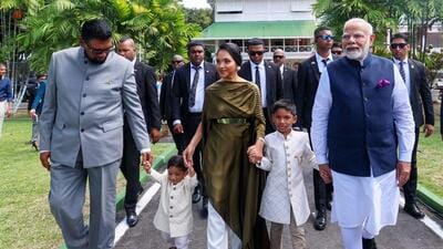 Prime Minister Narendra Modi and President of Guyana Mohamed Irfaan Ali arrive to plant a sapling under the ‘Ek Ped Maa Ke Naam’ initiative in Georgetown on Wednesday. (PTI) Prime Minister Narendra Modi and President of Guyana Mohamed Irfaan Ali arrive to plant a sapling under the ‘Ek Ped Maa Ke Naam’ initiative in Georgetown on Wednesday. (PTI)