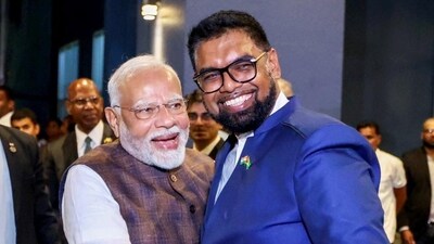 Prime Minister Narendra Modi being received by Guyana President Mohamed Irfaan Ali upon his arrival at the hotel in Georgetown, Guyana. (PTI) Prime Minister Narendra Modi being received by Guyana President Mohamed Irfaan Ali upon his arrival at the hotel in Georgetown, Guyana. (PTI)