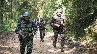Security personnel during a combing operation in Kabbinale forest area of in Udupi district in Karnataka. (PTI) Security personnel during a combing operation in Kabbinale forest area of in Udupi district in Karnataka. (PTI)