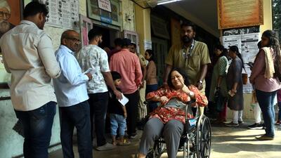people queue up at a voting centre in the city on Wednesday. (HT PHOTO)