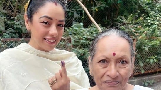 Anupama actor Rupali Ganguly shows her inked finger after casting vote.