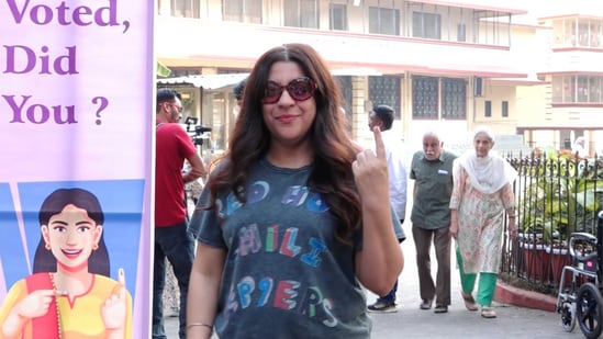 Zoya Akhtar shows her inked finger after casting vote. Her mother Honey Irani was also there.