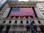 US flags hang on the building of the New York Stock Exchange (NYSE), after U.S. President-elect Donald Trump won the presidential election, in New York City, U.S., November 6, 2024. 