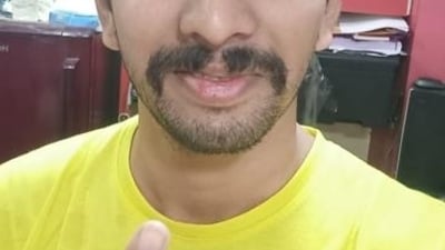 A first-time voter shows his inked finger. (HT PHOTO)