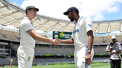 Australia'ss captain Pat Cummins (L) shakes hands with India's captain Jasprit Bumrah after posing with the trophy. (AFP) Australia'ss captain Pat Cummins (L) shakes hands with India's captain Jasprit Bumrah after posing with the trophy. (AFP)