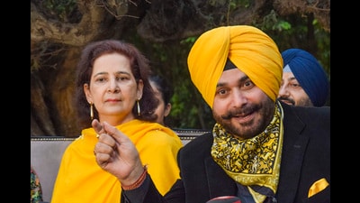 Congress leader Navjot Singh Sidhu with his wife Navjot Kaur Sidhu addresses a press conference, in Amritsar on Thursday. (PTI) Congress leader Navjot Singh Sidhu with his wife Navjot Kaur Sidhu addresses a press conference, in Amritsar on Thursday. (PTI)