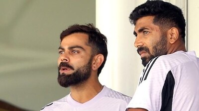 India players Virat Kohli and Jasprit Bumrah watch the internal practice match in Perth. (AFP) (HT_PRINT) India players Virat Kohli and Jasprit Bumrah watch the internal practice match in Perth. (AFP) (HT_PRINT)