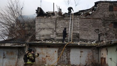 Firefighters work at the site of a Russian missile strike, amid Russia's attack on Ukraine, in Dnipro, Ukraine November 21, 2024. (via REUTERS)
