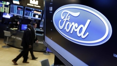 The logo for the Ford Motor Company appears above a post on the floor of the New York Stock Exchange (AP) The logo for the Ford Motor Company appears above a post on the floor of the New York Stock Exchange (AP)