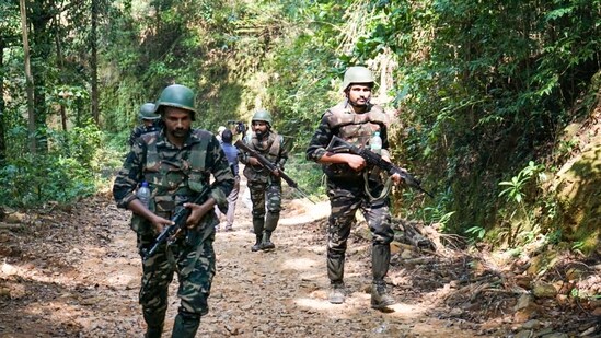 Udupi: Security personnel during a combing operation in Kabbinale forest area, in Udupi district, Karnataka. Vikram Gowda, a Naxalite, was shot dead by Anti-Naxal Force (ANF) during the operation, official sources said on Tuesday. (PTI Photo) (PTI)