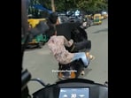 Two youngsters performed dangerous stunts on a busy Bengaluru road.
Two youngsters performed dangerous stunts on a busy Bengaluru road.