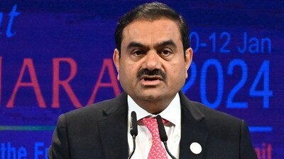 Chairperson of Indian conglomerate Adani Group, Gautam Adani addresses a gathering during the inaugural session of Vibrant Gujarat Global Summit 2024 in Gandhinagar. (AFP)