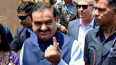 Gautam Adani, chairperson of Indian conglomerate Adani Group, shows his inked finger after casting his vote in Ahmedabad during the Lok Sabha elections. (AFP file) Gautam Adani, chairperson of Indian conglomerate Adani Group, shows his inked finger after casting his vote in Ahmedabad during the Lok Sabha elections. (AFP file)