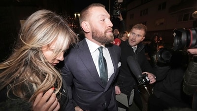 Mixed martial arts fighter Conor McGregor and partner Dee Devlin leave the High Court (Brian Lawless/PA via AP) (AP) Mixed martial arts fighter Conor McGregor and partner Dee Devlin leave the High Court (Brian Lawless/PA via AP) (AP)