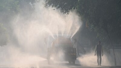 A tanker sprays water on roads to settle air pollution in Noida, which neighbours Delhi. (Sunil Ghosh/Hindustan Times) A tanker sprays water on roads to settle air pollution in Noida, which neighbours Delhi. (Sunil Ghosh/Hindustan Times)
