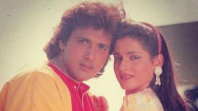 Govinda and Neelam in a still from the film Ilzaam. Govinda and Neelam in a still from the film Ilzaam.
