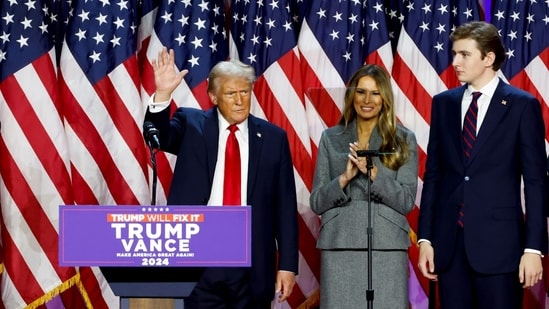 Former US President Donald Trump, from left, former US First Lady Melania Trump, and their son Barron Trump during an election night event at the Palm Beach Convention Center in West Palm Beach, Florida, US, on Wednesday, Nov. 6, 2024.. Photographer: Eva Marie Uzcategui/Bloomberg (Bloomberg)