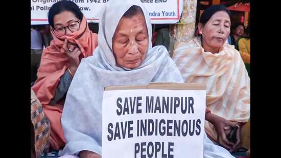 Women from Lamlai village and Chalou village stage a sit-in protest in Imphal East against the violence and tension in Manipur. (ANI Photo)