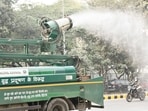 Delhi pollution: An anti-smog gun on a multi-purpose vehicle sprays water droplets to curb air pollution.
