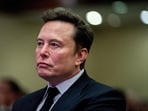 FILE PHOTO: Tesla CEO and X owner Elon Musk listens as US President-elect Donald Trump speaks during a meeting with House Republicans at the Hyatt Regency hotel in Washington, DC, U.S. on November 13, 2024.  ALLISON ROBBERT/Pool via REUTERS/File Photo