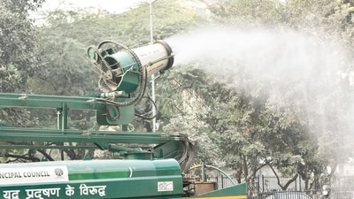 Delhi pollution: An anti-smog gun on a multi-purpose vehicle sprays water droplets to curb air pollution. (ANI file photo) Delhi pollution: An anti-smog gun on a multi-purpose vehicle sprays water droplets to curb air pollution. (ANI file photo)