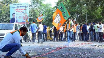 Bharatiya Janata Party (BJP) supporters burst crackers during a celebration as Maharashtra deputy chief minister and party candidate Devendra Fadnavis leads from the Nagpur South West Constituency in the state assembly elections, in Nagpur on Saturday. (ANI) Bharatiya Janata Party (BJP) supporters burst crackers during a celebration as Maharashtra deputy chief minister and party candidate Devendra Fadnavis leads from the Nagpur South West Constituency in the state assembly elections, in Nagpur on Saturday. (ANI)