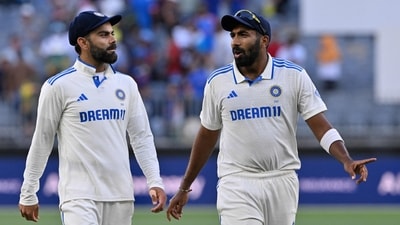 India's Jasprit Bumrah (R) and Virat Kohli walk back to the pavilion at the end of the first play during the first day of the first Test cricket match. (AFP) India's Jasprit Bumrah (R) and Virat Kohli walk back to the pavilion at the end of the first play during the first day of the first Test cricket match. (AFP)