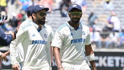 India's skipper Jasprit Bumrah (R) and Virat Kohli walk back to the pavilion at the end of Australia's innings on day two of the Perth Test (AFP) India's skipper Jasprit Bumrah (R) and Virat Kohli walk back to the pavilion at the end of Australia's innings on day two of the Perth Test (AFP)