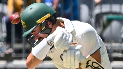 Australia's Mitchell Starc avoids a bouncer delivery by India's Jasprit Bumrah on day two of the first Test. (AFP)