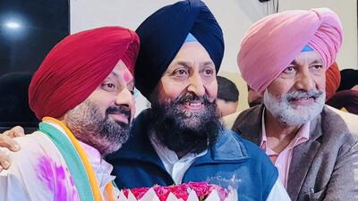 Congress’ Kuldeep Singh Dhillon (left) with party leaders Partap Singh Bajwa and Balbir Singh Sidhu after the win. (SOURCED)