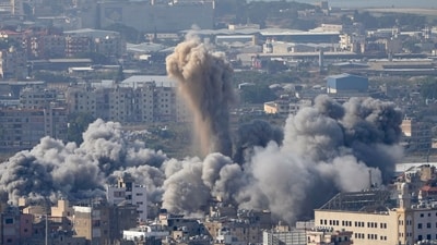 Smoke rises between buildings hit by an Israeli airstrike in Dahiyeh, the southern suburb of Beirut, Lebanon, Thursday, Nov. 14, 2024. (AP Photo/Hussein Malla) (AP) Smoke rises between buildings hit by an Israeli airstrike in Dahiyeh, the southern suburb of Beirut, Lebanon, Thursday, Nov. 14, 2024. (AP Photo/Hussein Malla) (AP)
