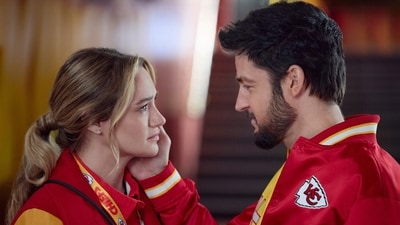 This image released by Hallmark Media shows Hunter King, left, and Tyler Hynes in a scene from "Holiday Touchdown: A Chiefs Love Story. (Joshua Haines/Hallmark Media via AP) (AP) This image released by Hallmark Media shows Hunter King, left, and Tyler Hynes in a scene from "Holiday Touchdown: A Chiefs Love Story. (Joshua Haines/Hallmark Media via AP) (AP)
