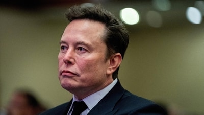 FILE PHOTO: Tesla CEO and X owner Elon Musk listens as US President-elect Donald Trump speaks during a meeting with House Republicans at the Hyatt Regency hotel in Washington, DC, U.S. on November 13, 2024.  ALLISON ROBBERT/Pool via REUTERS/File Photo (via REUTERS)