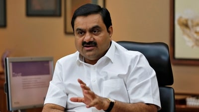 FILE PHOTO: Indian billionaire Gautam Adani speaks during an interview with Reuters at his office in the western Indian city of Ahmedabad April 2, 2014. REUTERS/Amit Dave/File Photo