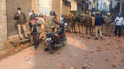 Police and security personnel stand guard amid violence during a second survey of the Jama Masjid, claimed to be originally the site of an ancient Hindu temple, in Sambhal. (PTI) Police and security personnel stand guard amid violence during a second survey of the Jama Masjid, claimed to be originally the site of an ancient Hindu temple, in Sambhal. (PTI)