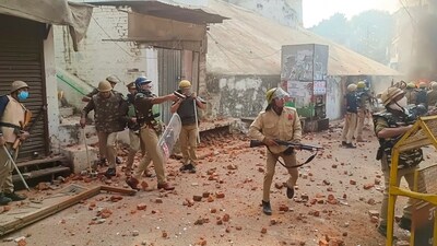 Police try to control situation after violence erupted during the second survey of the Jama Masjid, claimed to be originally the site of an ancient Hindu temple, in Sambhal, on Sunday, (PTI) Police try to control situation after violence erupted during the second survey of the Jama Masjid, claimed to be originally the site of an ancient Hindu temple, in Sambhal, on Sunday, (PTI)