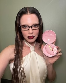 Julia Fox goes for a bleached eyebrow, skinny glasses, and black-lined, blood-red lips for a coquettish look (Photo: Instagram) Julia Fox goes for a bleached eyebrow, skinny glasses, and black-lined, blood-red lips for a coquettish look (Photo: Instagram)