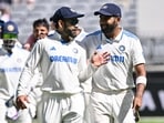 India's skipper Jasprit Bumrah (R) and Virat Kohli (L) speak as they walk back to the pavilion at the tea break on day four of the first Test cricket match between Australia and India India's skipper Jasprit Bumrah (R) and Virat Kohli (L) speak as they walk back to the pavilion at the tea break on day four of the first Test cricket match between Australia and India