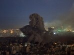 Smoke billows over Beirut's southern suburbs after an Israeli strike, amid the ongoing hostilities between Hezbollah and Israeli forces. 
