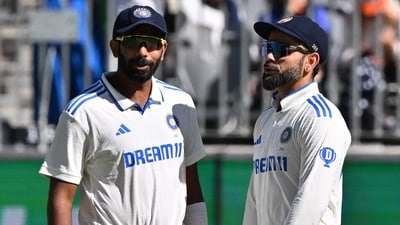 India's Virat Kohli (R) and Jasprit Bumrah talk on day four of the first Test cricket match between Australia and India. (Photo by SAEED KHAN / AFP) (AFP) India's Virat Kohli (R) and Jasprit Bumrah talk on day four of the first Test cricket match between Australia and India. (Photo by SAEED KHAN / AFP) (AFP)