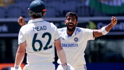 .Jasprit Bumrah (R) celebrates the wicket of Australia�s Travis Head (L) on day four of the first Test cricket match between Australia and India. (AFP) .Jasprit Bumrah (R) celebrates the wicket of Australia�s Travis Head (L) on day four of the first Test cricket match between Australia and India. (AFP)