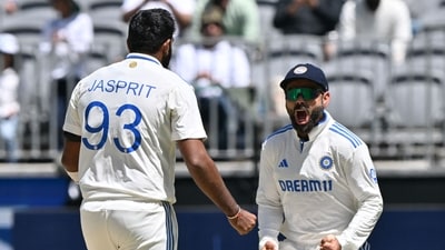 India's paceman Jasprit Bumrah (L) celebrates his wicket of Australia�s Travis Head with teammate Virat Kohli (AFP) India's paceman Jasprit Bumrah (L) celebrates his wicket of Australia�s Travis Head with teammate Virat Kohli (AFP)