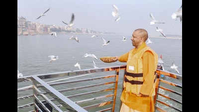 Chief minister Yogi Adityanath feeding migratory birds in Varanasi on Monday. (PTI) Chief minister Yogi Adityanath feeding migratory birds in Varanasi on Monday. (PTI)