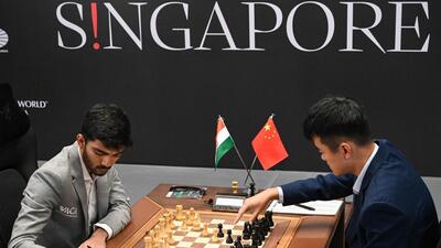 China’s Ding Liren (right) and India’s D Gukesh ) compete during the start of the FIDE World Chess Championship in Singapore on Monday. (AFP) China’s Ding Liren (right) and India’s D Gukesh ) compete during the start of the FIDE World Chess Championship in Singapore on Monday. (AFP)